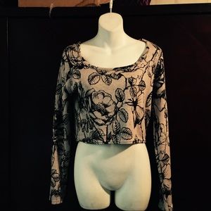 Like pink and black long sleeve crop top